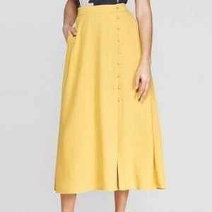 Anthropologie yellow midi skirt with button detail